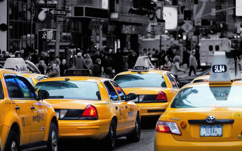 Yellow taxis in a busy city