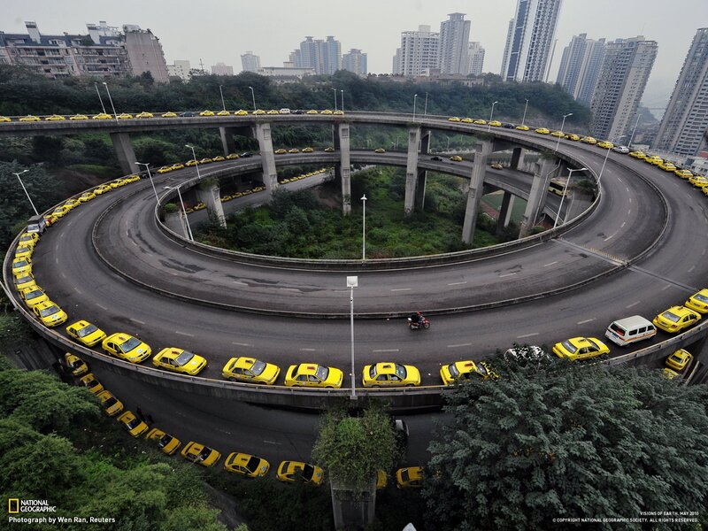 Yellow taxis on a spiral highway