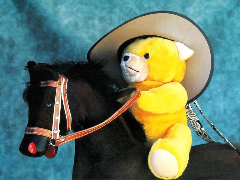 Yellow Teddy Bear on Horse