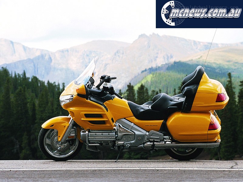 Yellow touring motorcycle on road