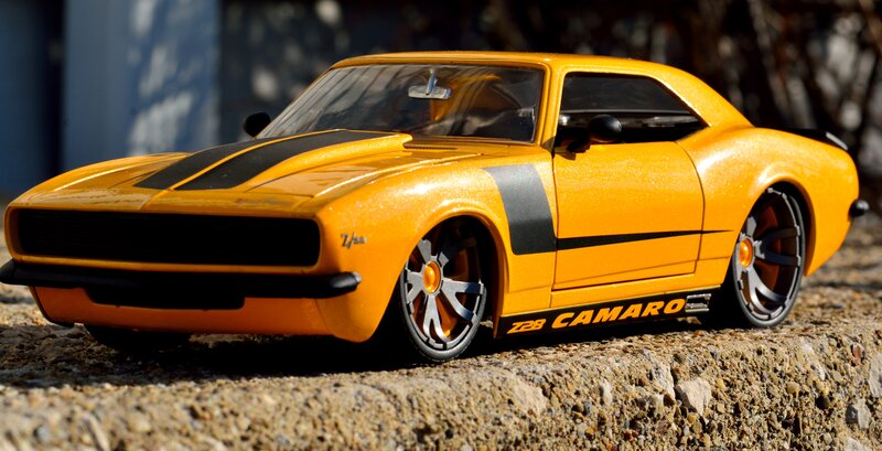 Yellow Toy Car — Dramatic, Afternoon, Photograph, Stone Surface