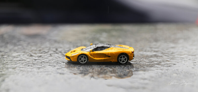 Yellow Toy Car — Dramatic, Photograph, Rain