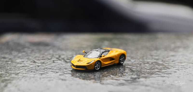 Yellow Toy Car — Dramatic, Photograph, Wet Surface, Raindrops