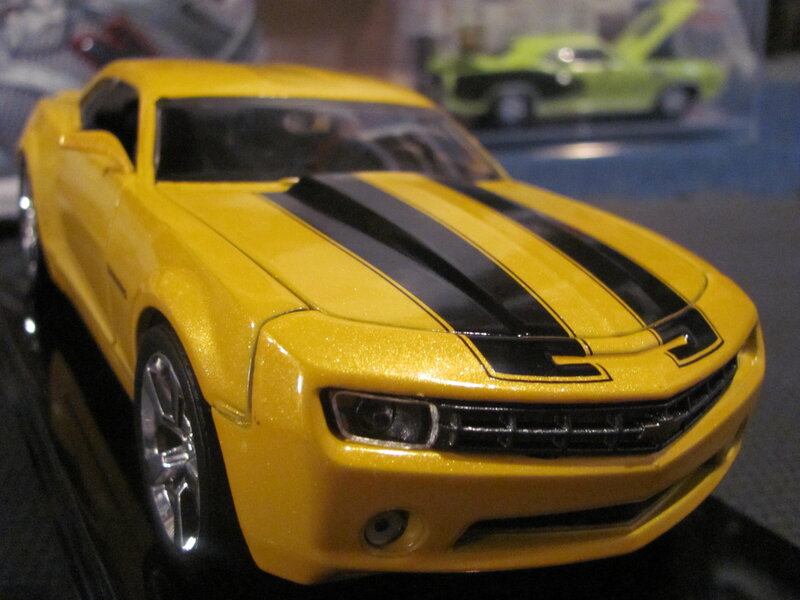 Yellow Toy Car — Neutral, Photograph, Black Stripes
