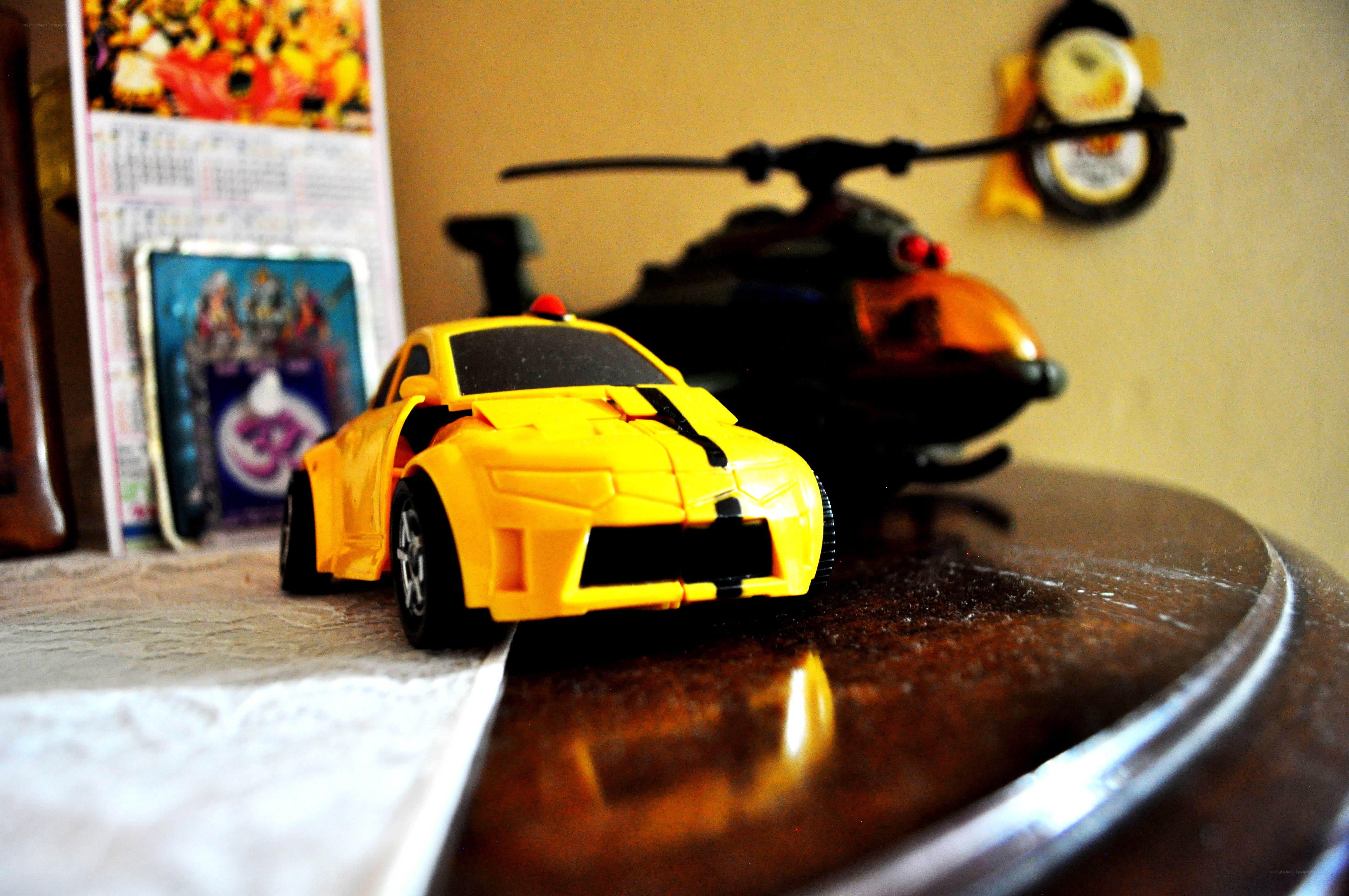 Yellow toy car on a table