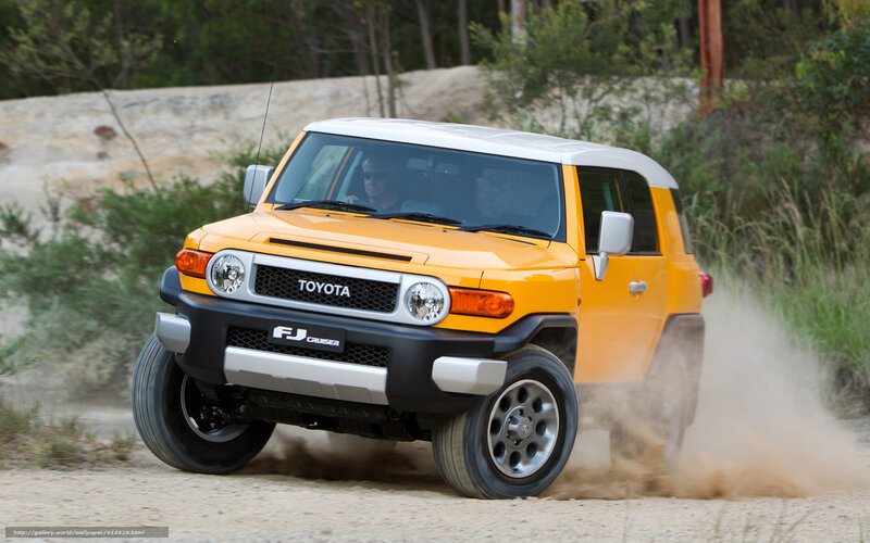 Yellow Toyota FJ Cruiser driving
