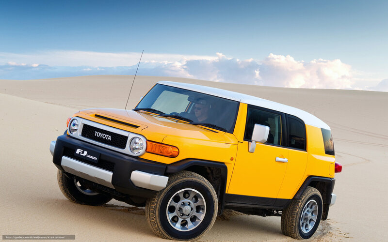 Yellow Toyota FJ Cruiser in desert