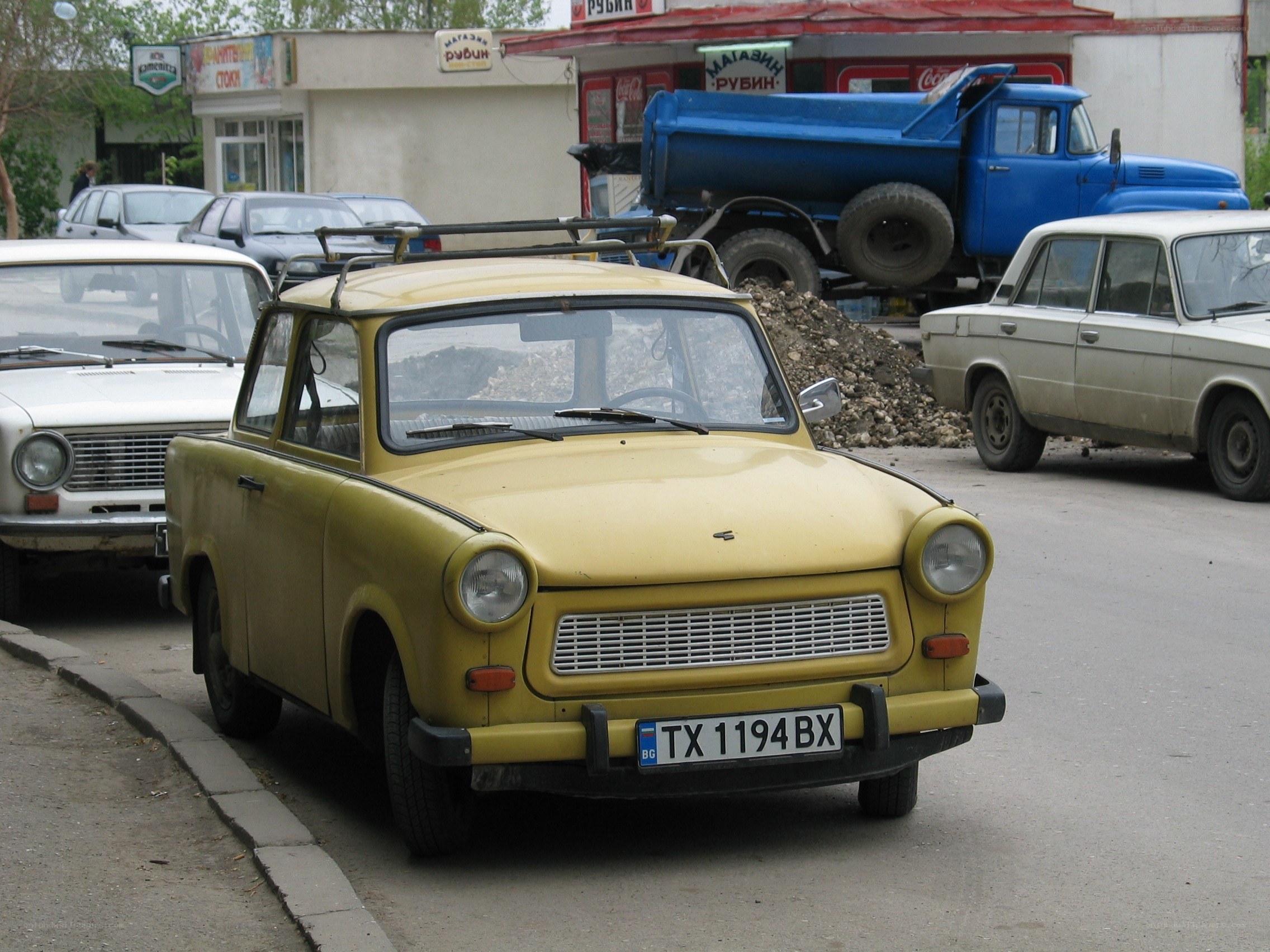 Yellow Trabant car on street