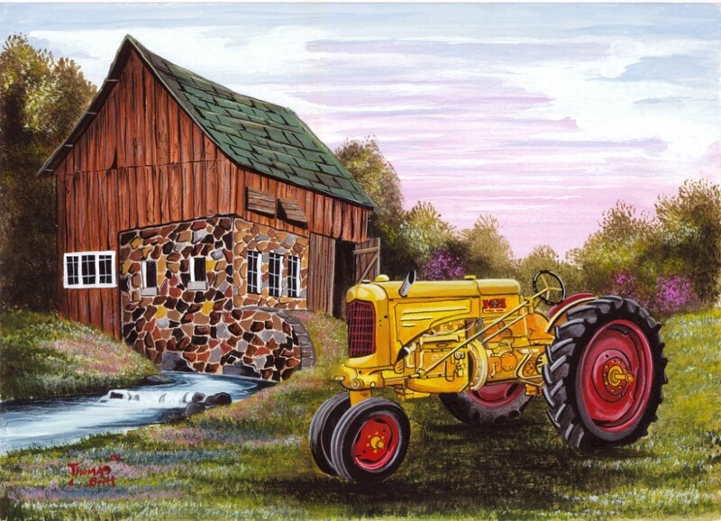 Yellow tractor by a mill
