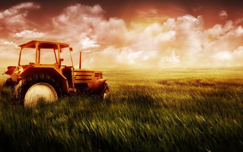 Yellow Tractor in Field — Green, Dramatic, Sunset, Photograph, Sky