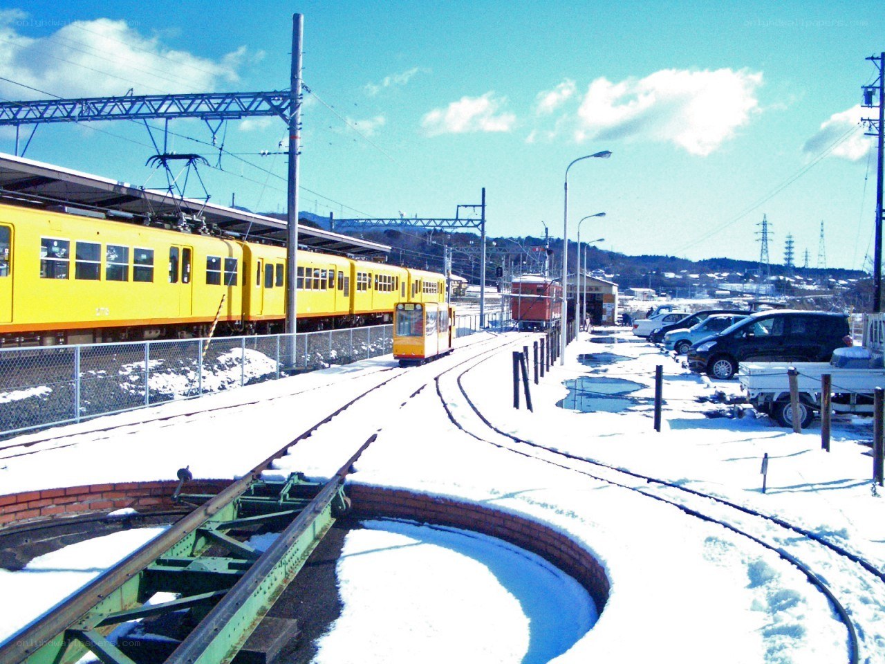Yellow train in snowy station