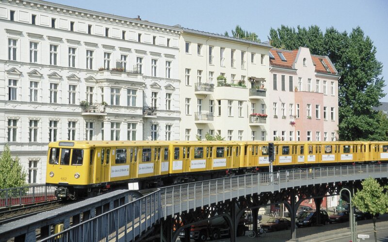 Yellow train on elevated track