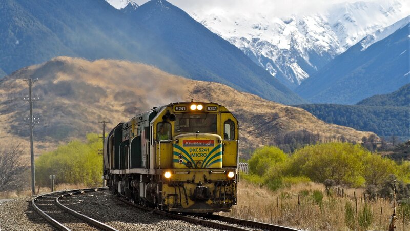 Yellow Train on Tracks — Dramatic, Afternoon
