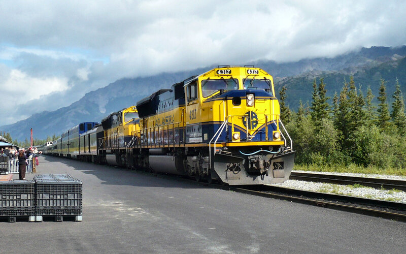 Yellow Train on Tracks — Dramatic