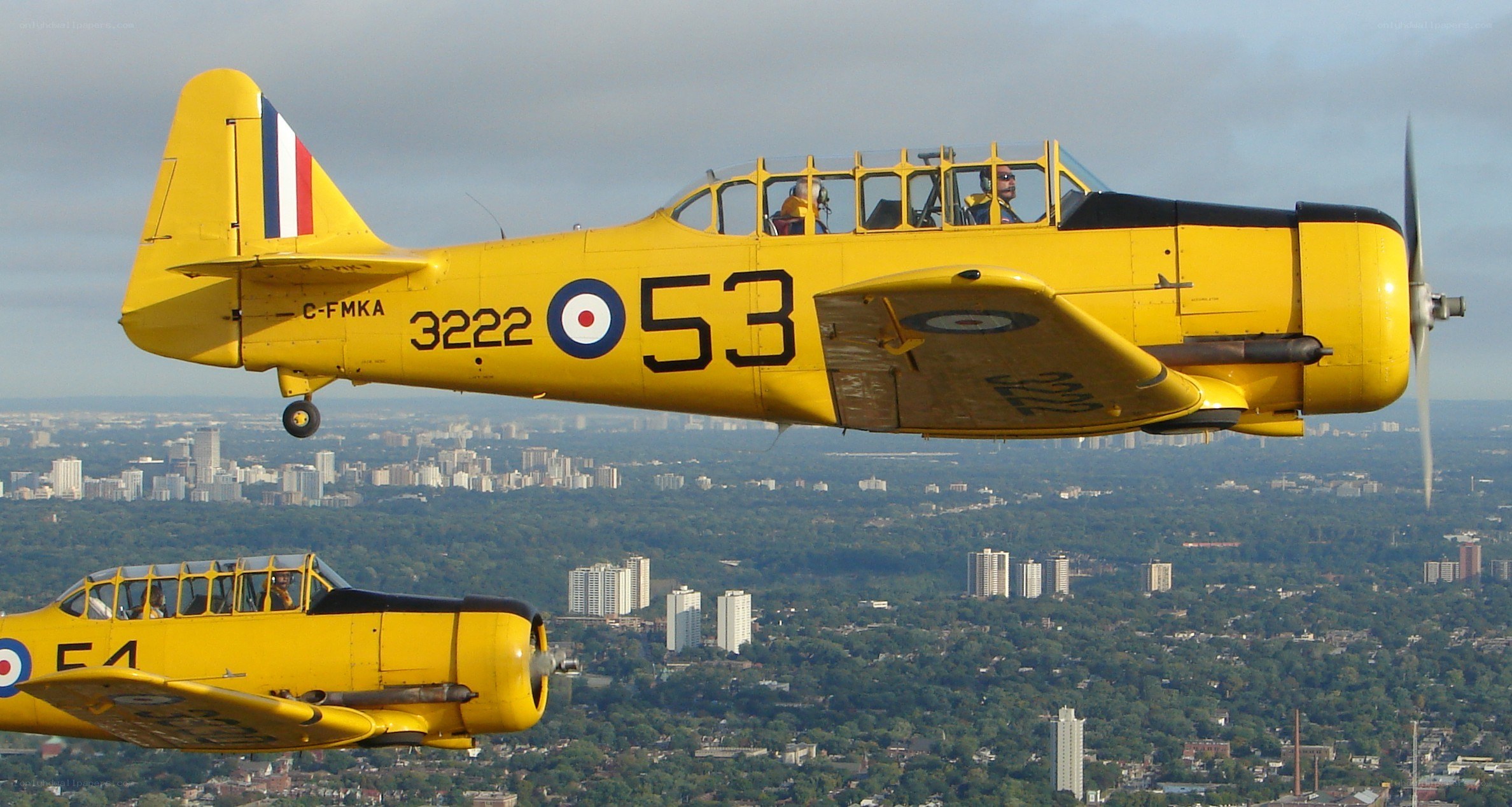 Yellow training aircraft in flight