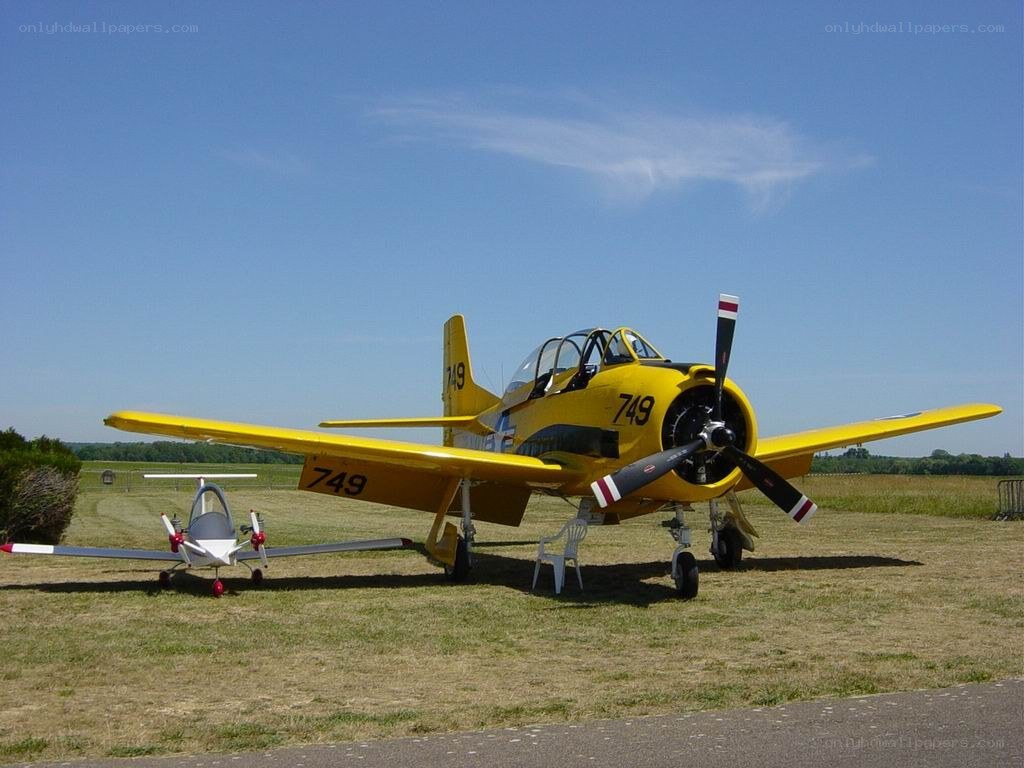 Yellow training aircraft on airfield