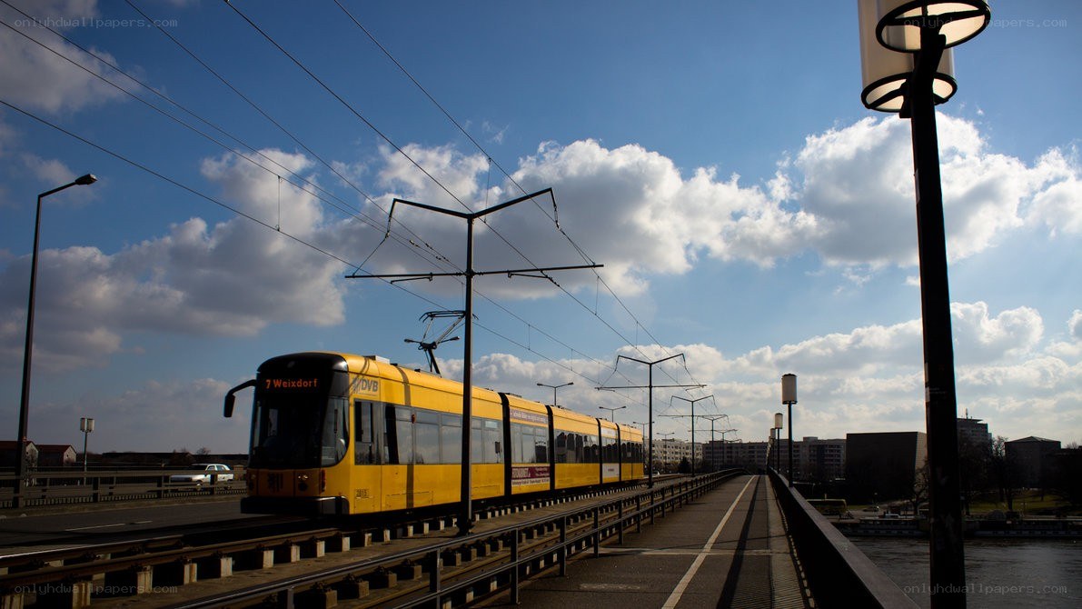 Yellow tram on a bridge