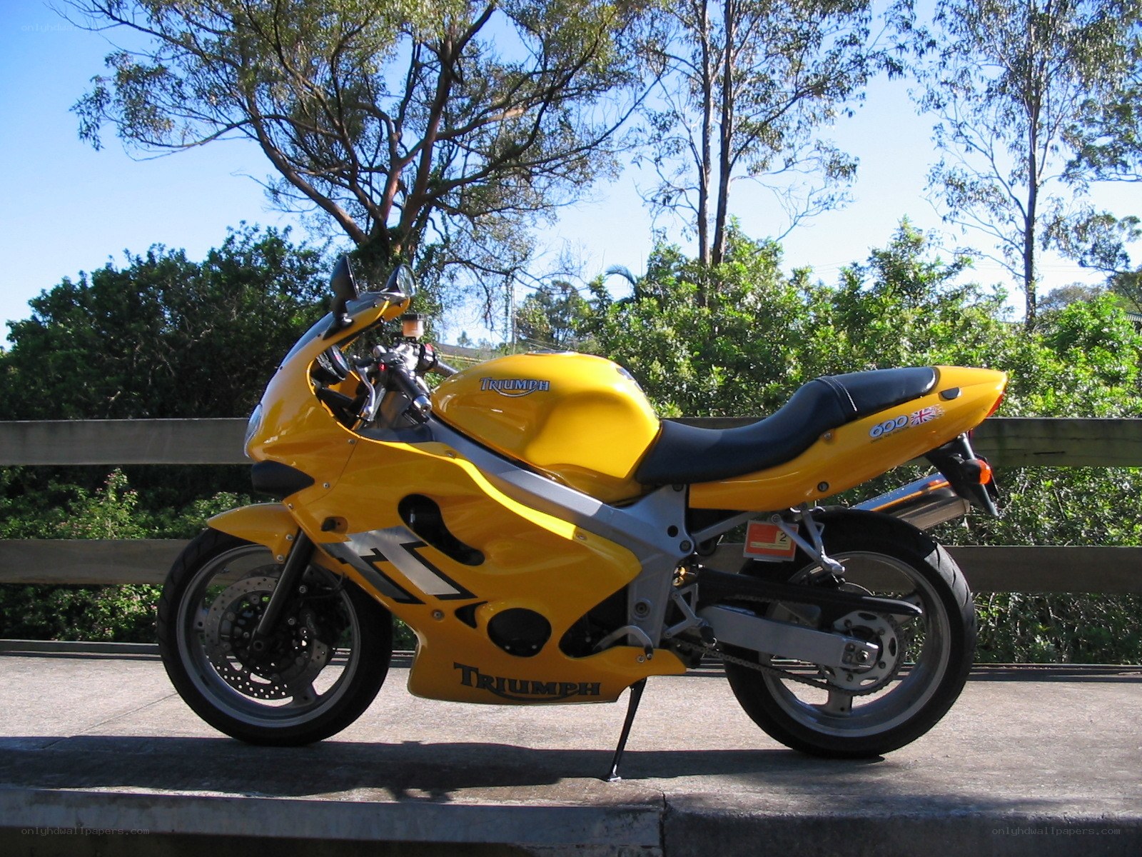 yellow triumph motorcycle