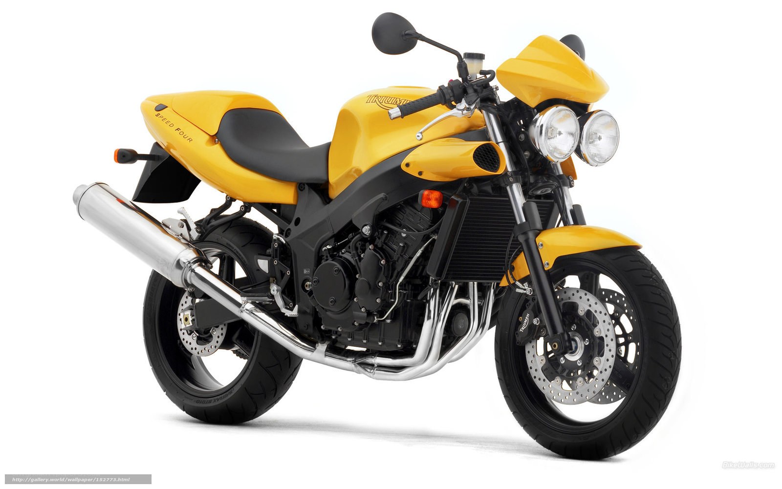 yellow triumph speed four motorcycle