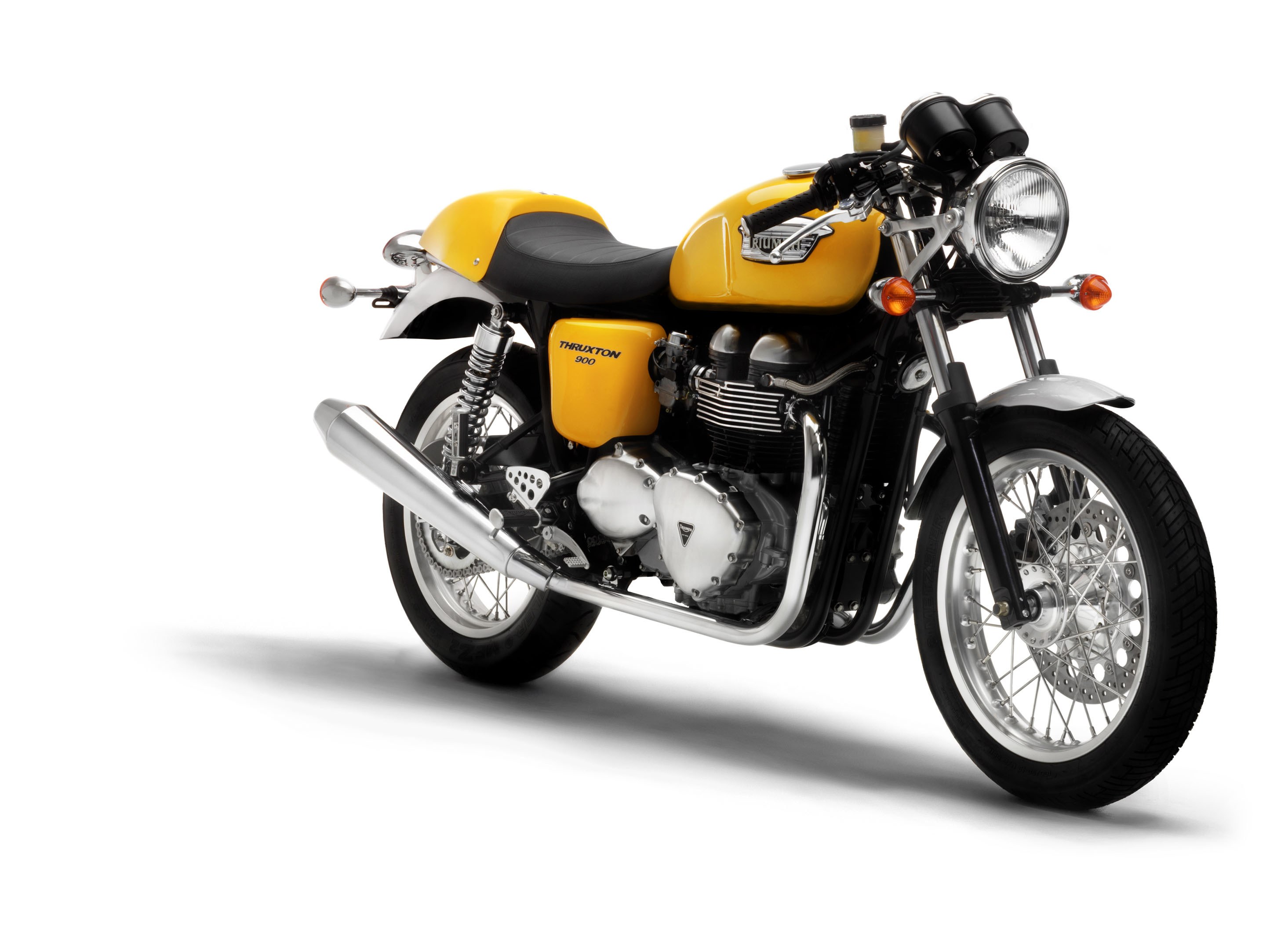 Yellow Triumph Thruxton motorcycle