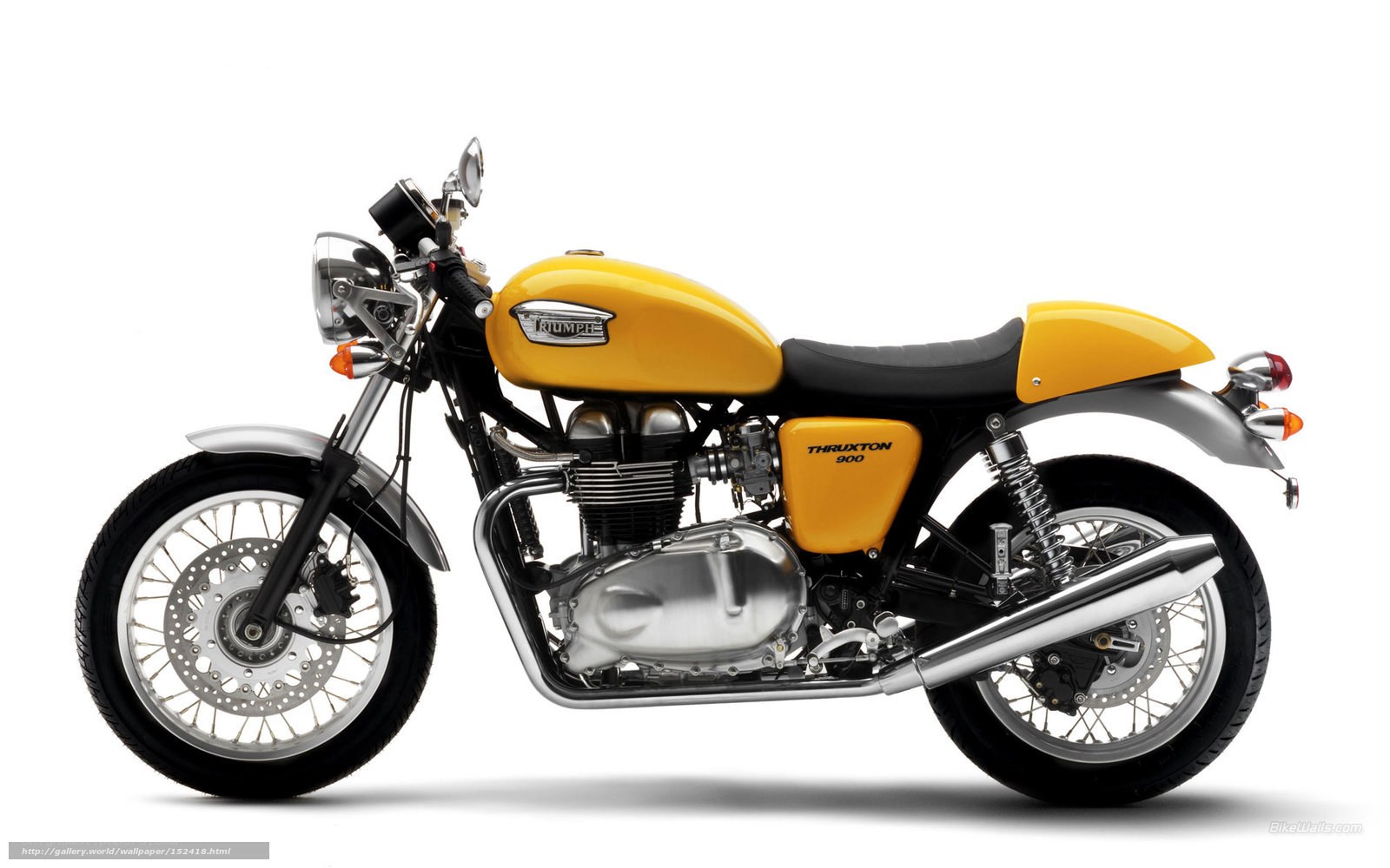 yellow triumph thruxton motorcycle