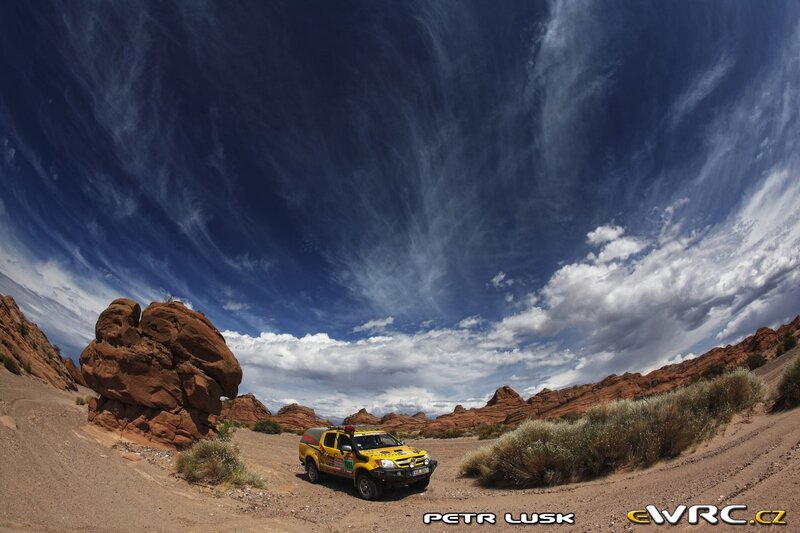 Yellow truck in desert canyon