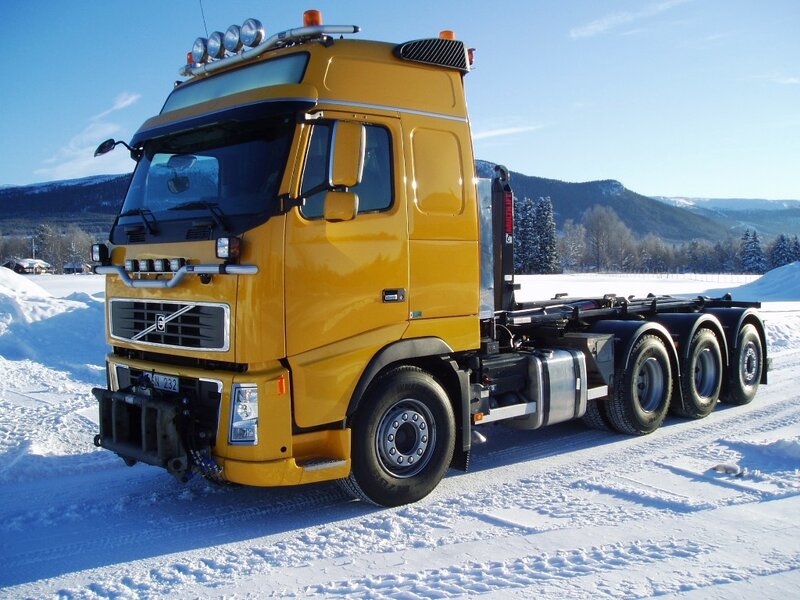 Yellow truck in snowy landscape