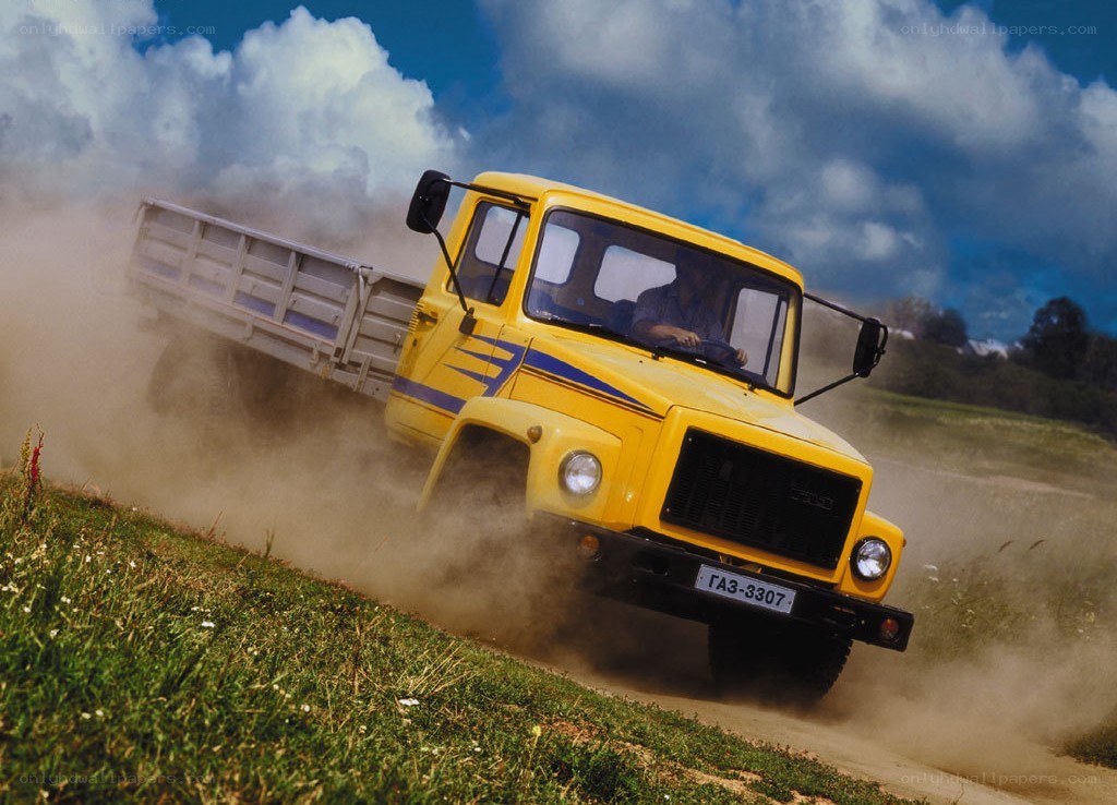 Yellow truck on dirt road