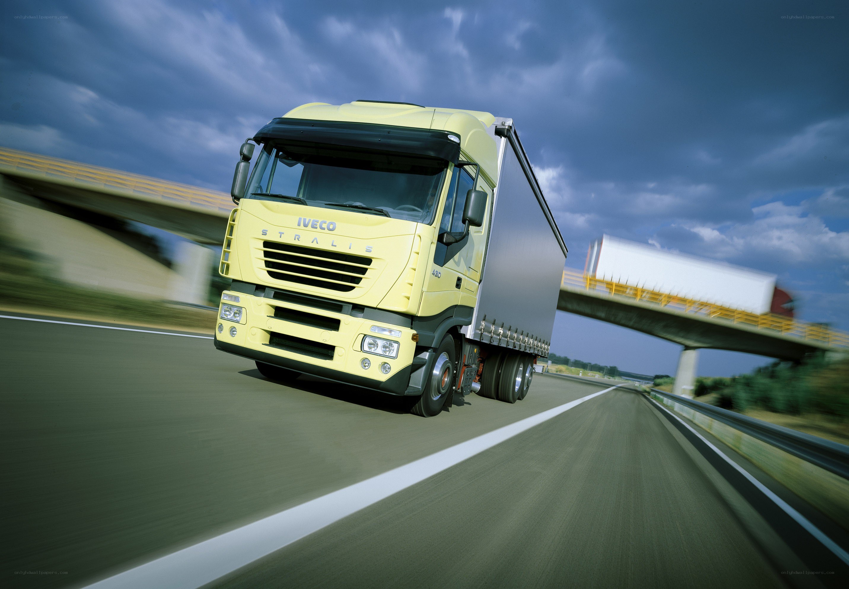 Yellow truck on highway