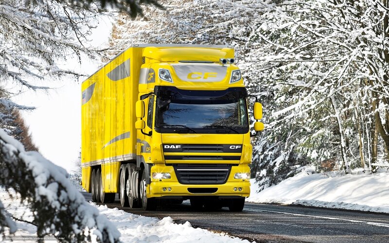 Yellow truck on snowy road