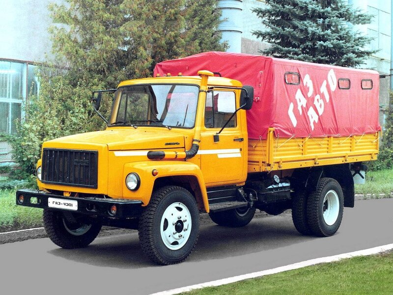 Yellow truck with red tarp