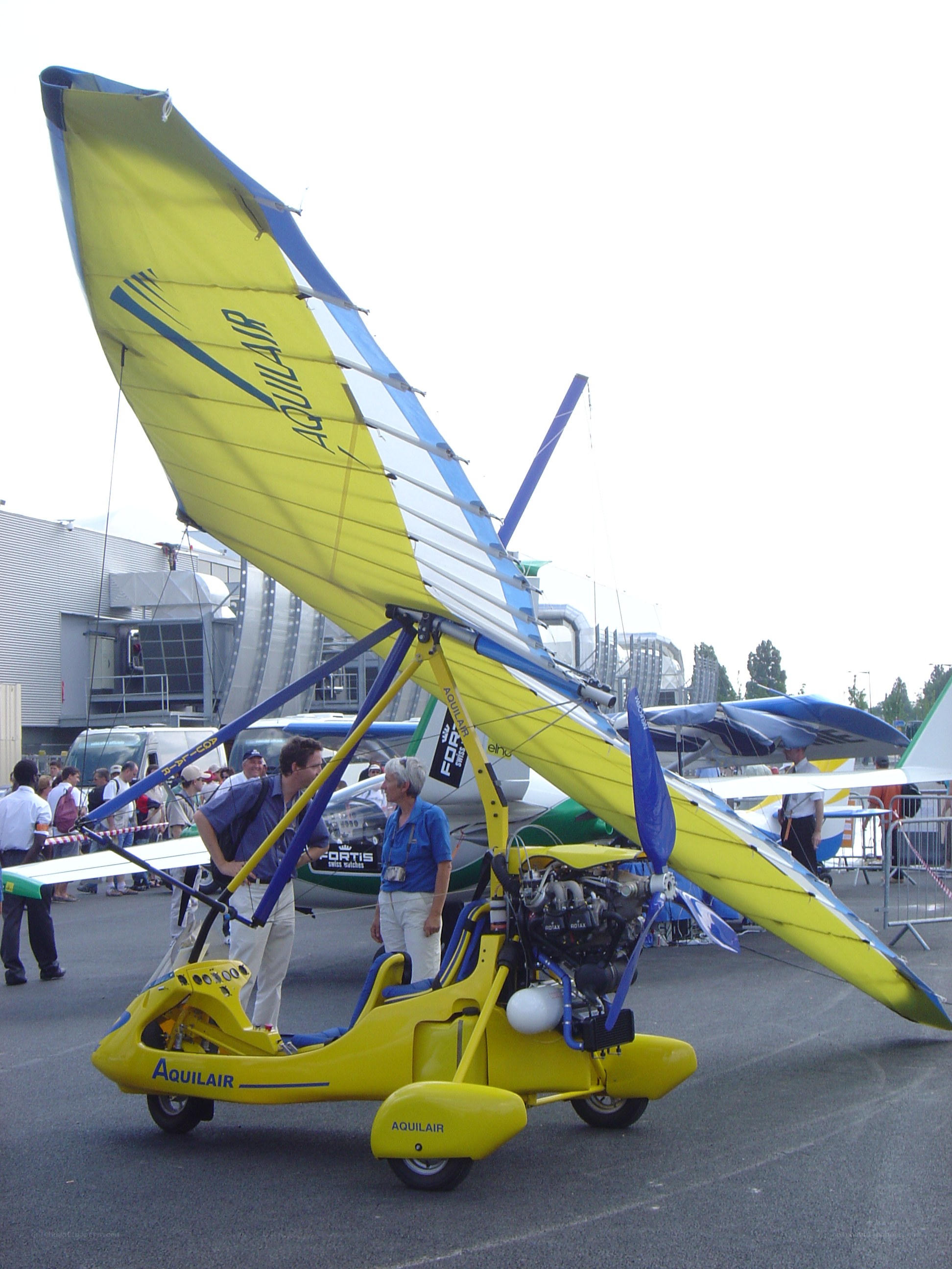 Yellow ultralight aircraft on display