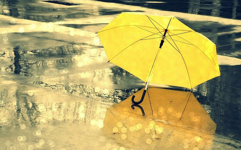 Yellow Umbrella in Puddle — Melancholic
