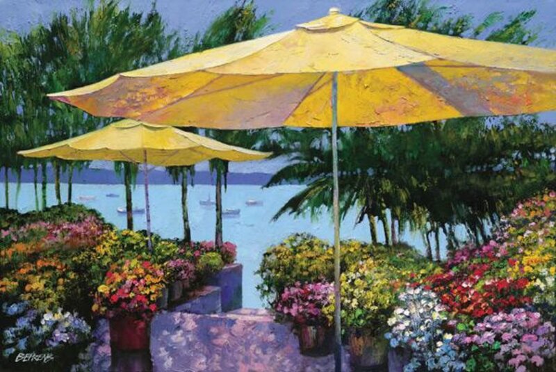 Yellow umbrellas by the water