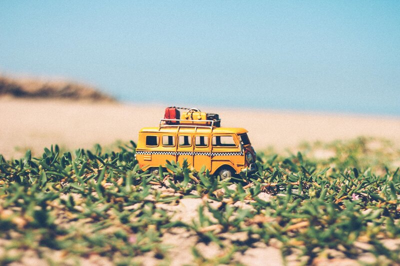 Yellow van on a beach