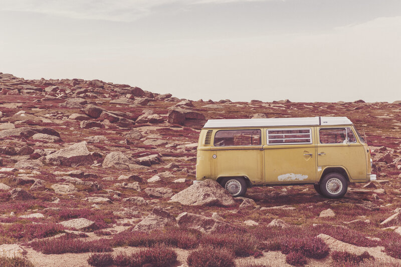 Yellow van on rocky hillside