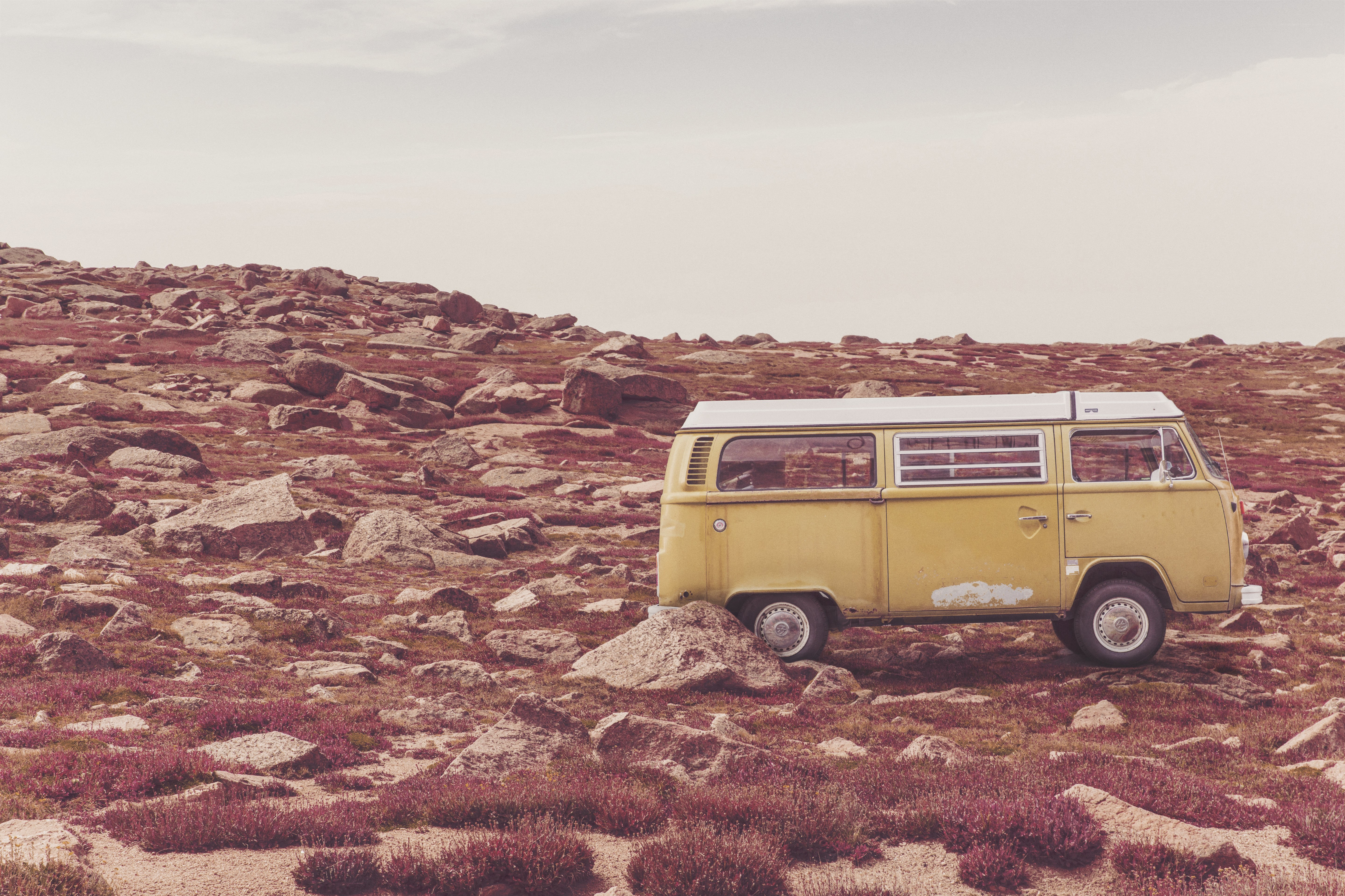 Yellow van on rocky hillside