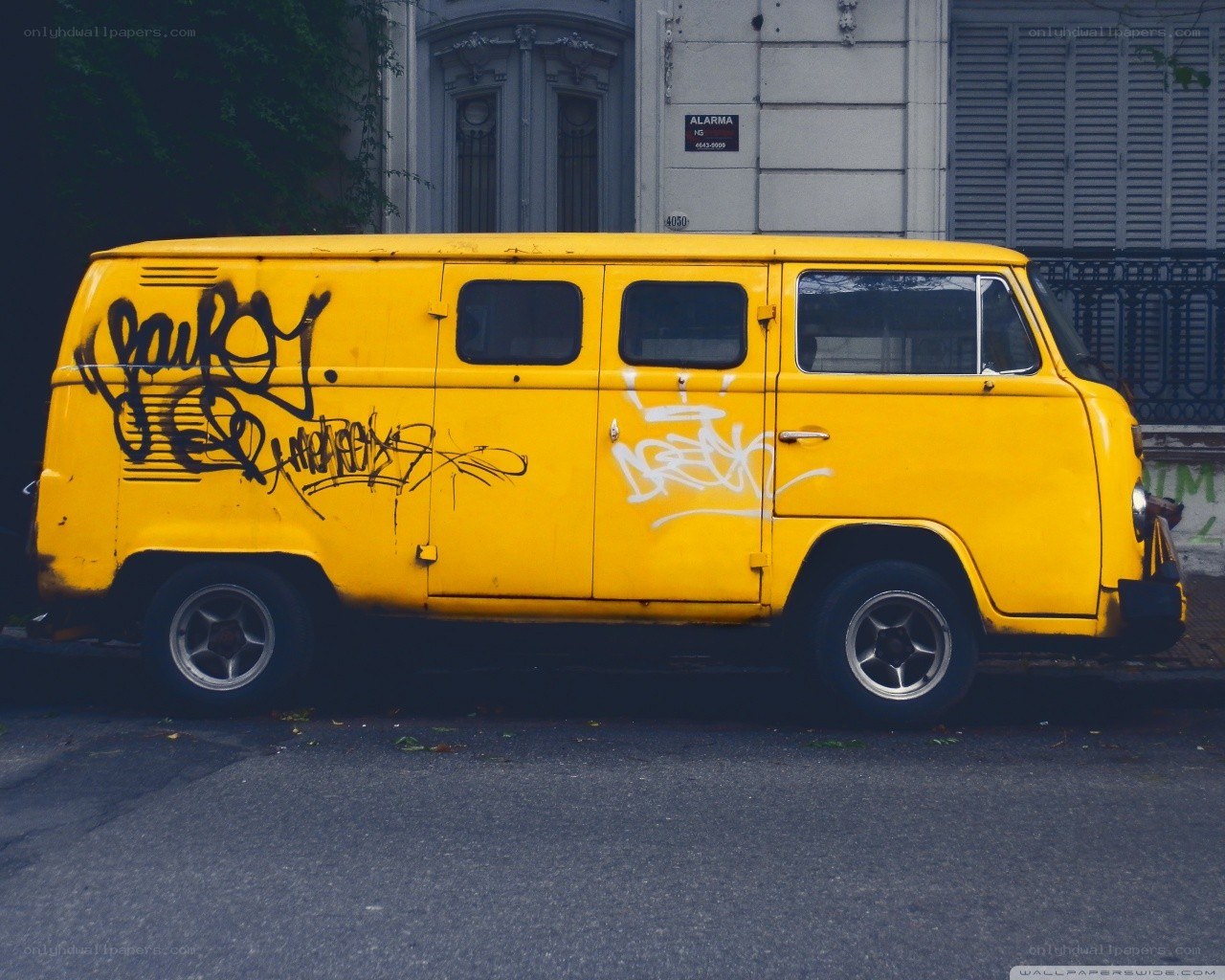 Yellow van with graffiti