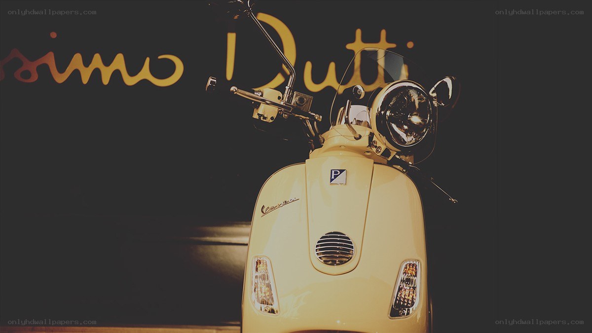 yellow vespa scooter display
