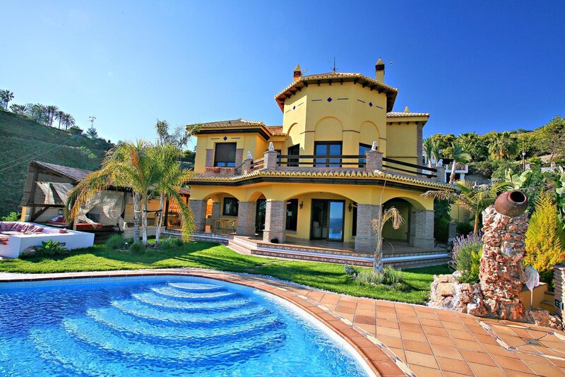 Yellow villa with pool and garden