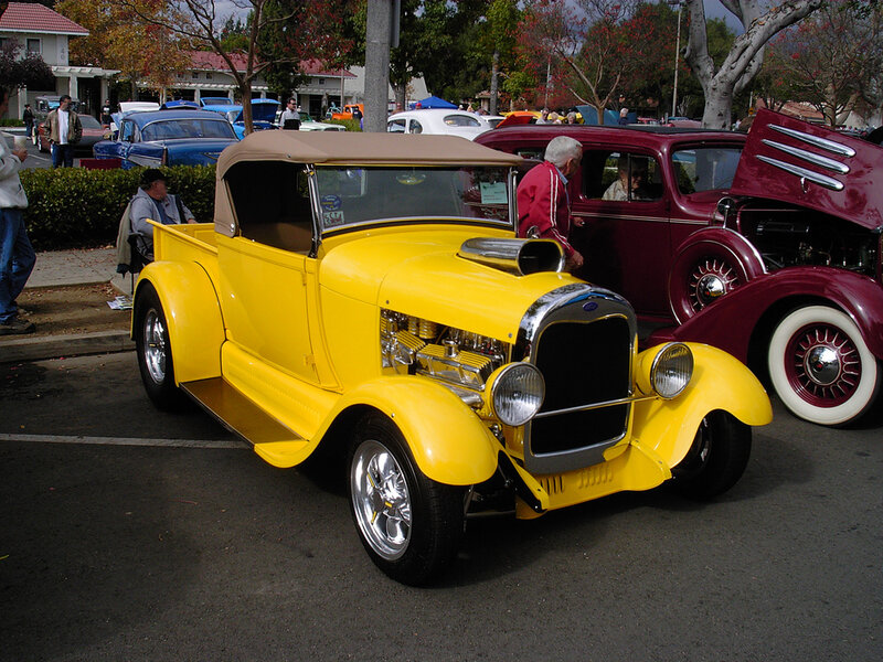 Yellow vintage car at a show