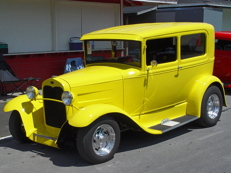 Yellow vintage car at a show