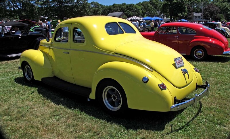Yellow vintage car at a show