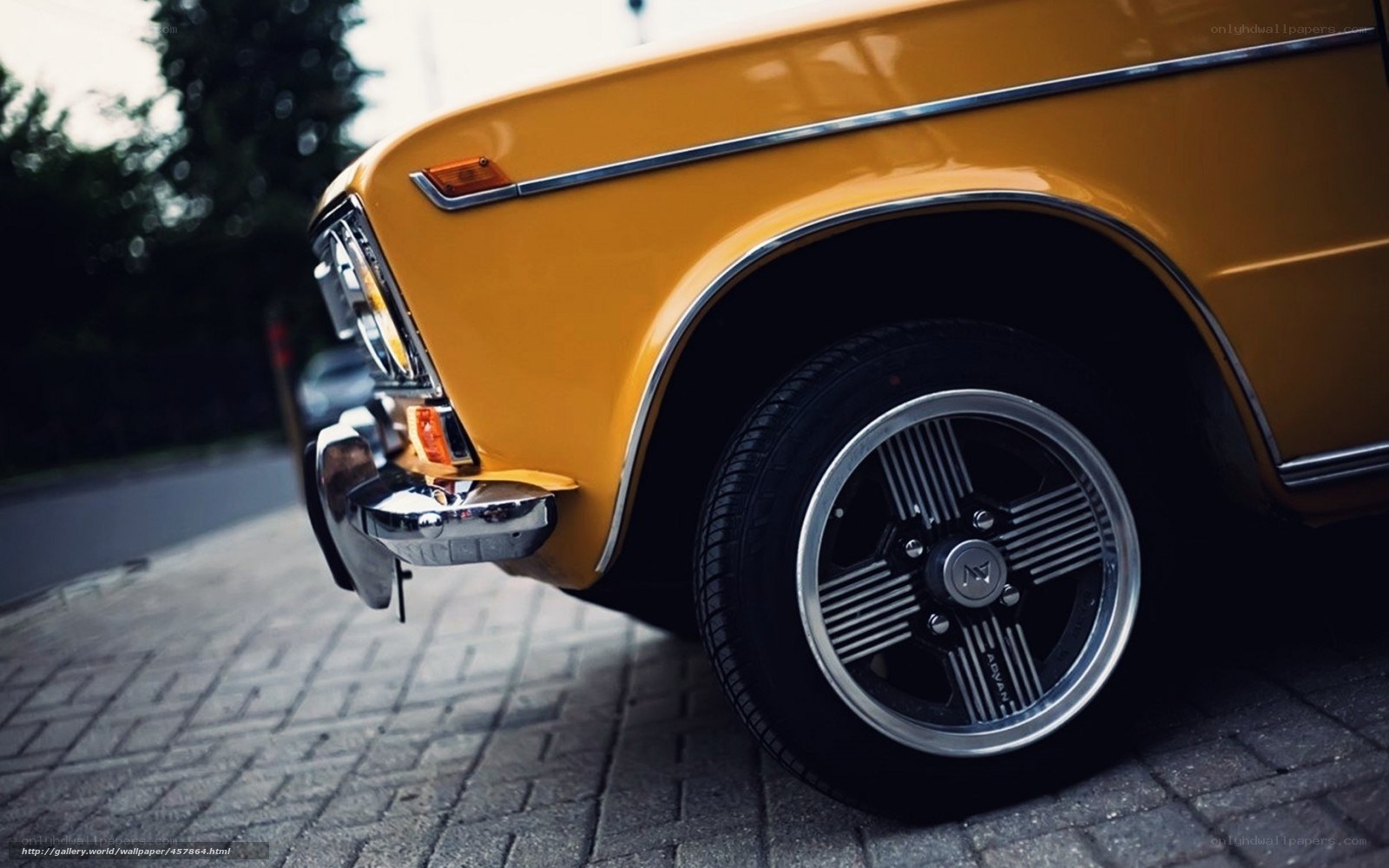 yellow vintage car front wheel
