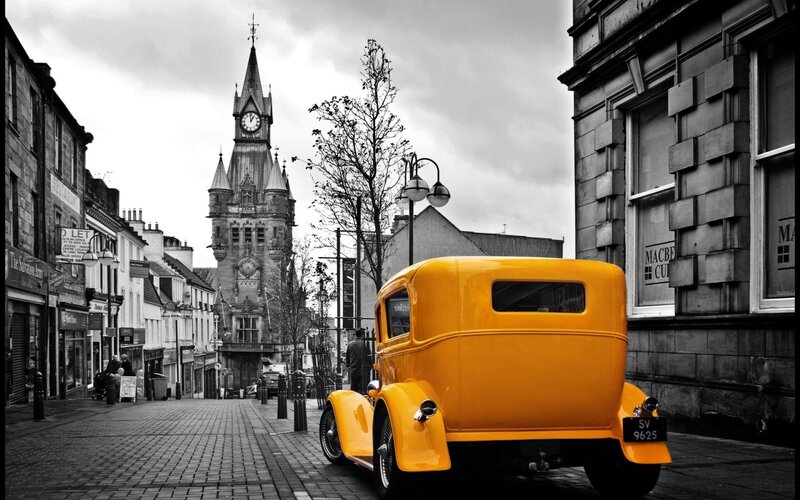 Yellow vintage car on a street
