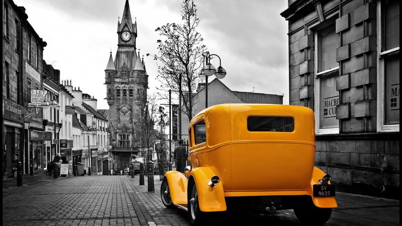 Yellow vintage car on a street