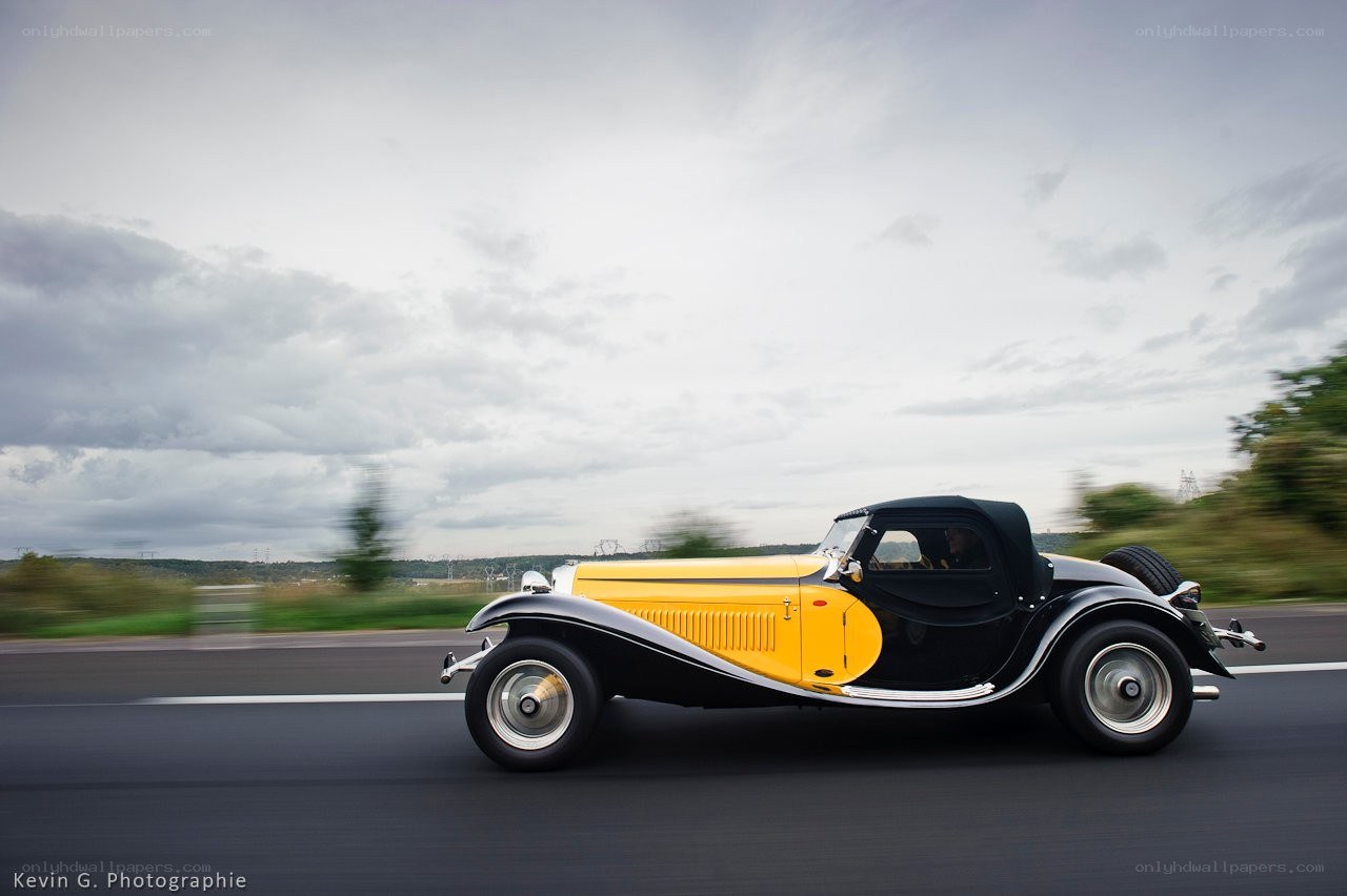 Yellow vintage car on road