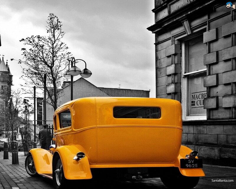 Yellow vintage car on street