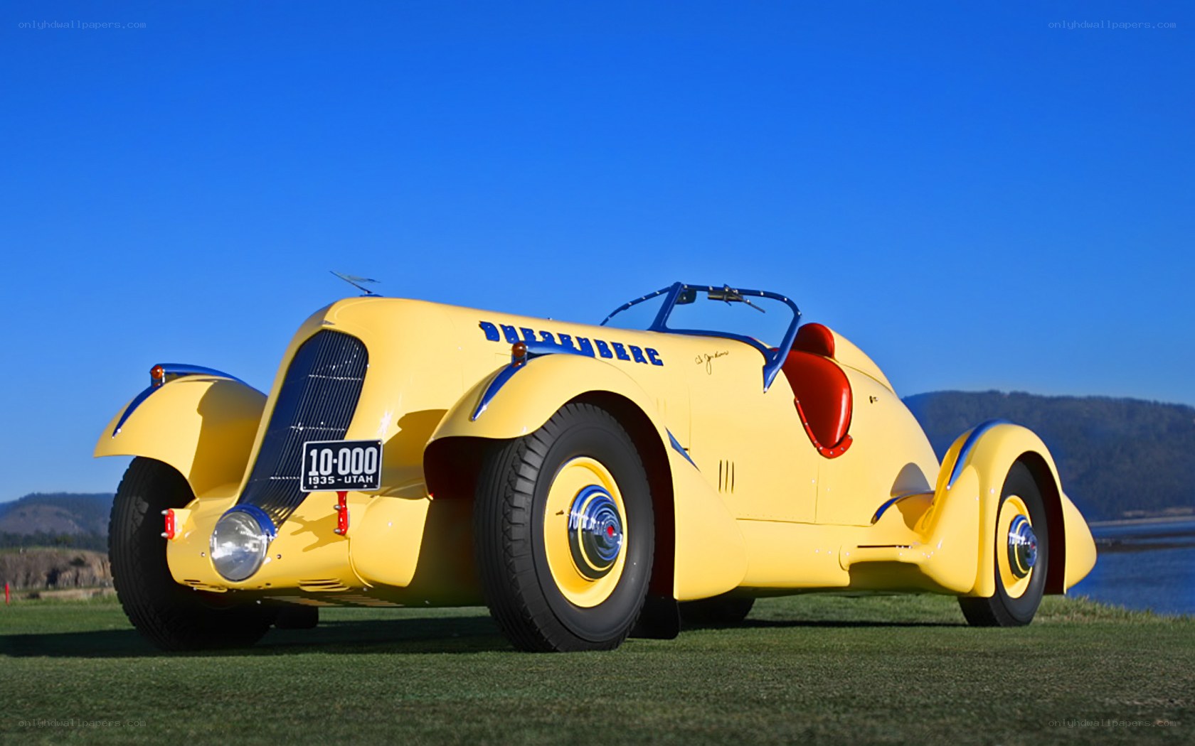 Yellow vintage Duesenberg car