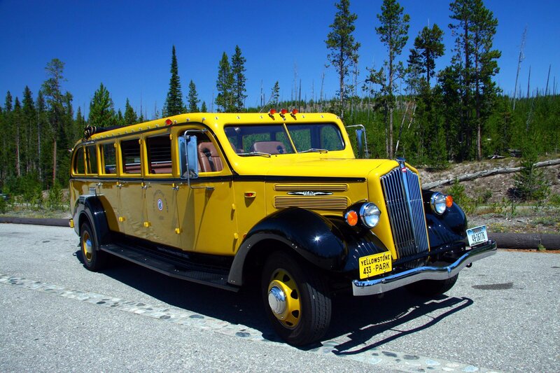 Yellow vintage tour bus in Yellowstone